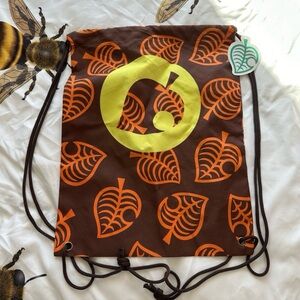 animal crossing culture fly drawstring bag brown / orange leaf print NWT